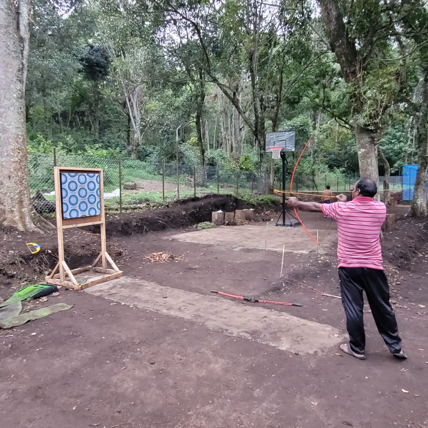 Customer enjoying archery activity in Munnar